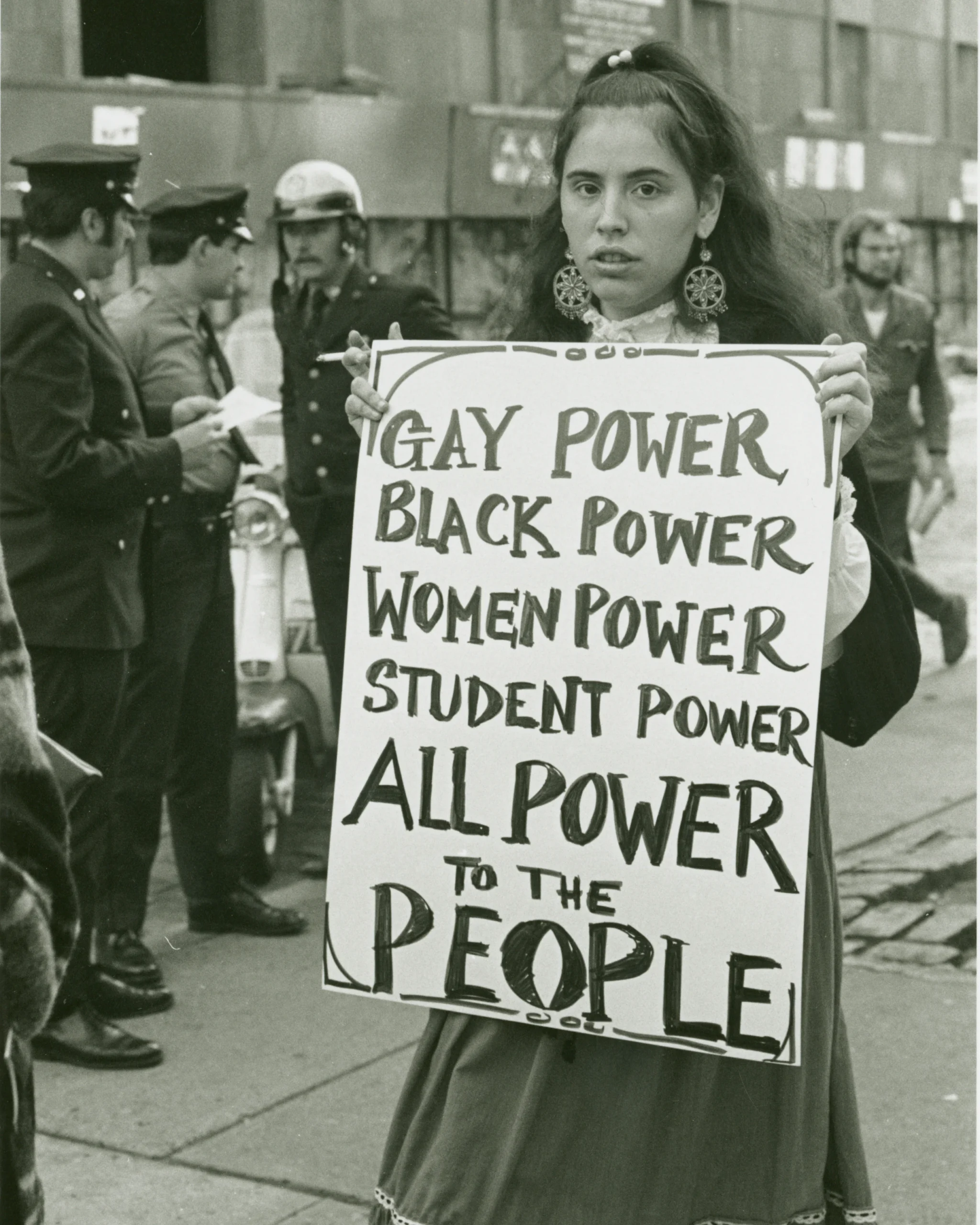 Protestor at Weinstein Hall demonstration for the rights of gay people on campus